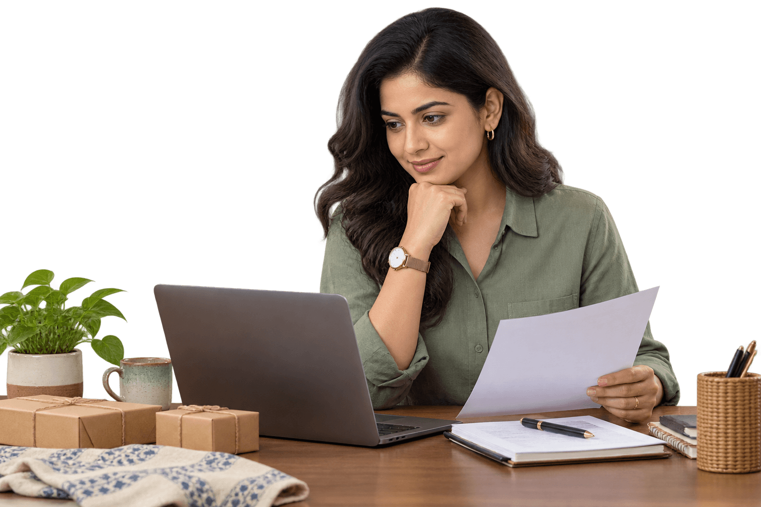 Indian business founder reviewing a customer enquiry at her desk